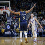 
              New Orleans Pelicans guard CJ McCollum (3) celebrates a three point basket next to Sacramento Kings guard Kevin Huerter (9) in the first half of an NBA basketball game in New Orleans, Sunday, Feb. 5, 2023. (AP Photo/Matthew Hinton)
            