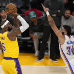 
              DELETES REFERENCE TO SHOT SETTING THE SCORING RECORD - Los Angeles Lakers forward LeBron James, left, shoots as Oklahoma City Thunder forward Kenrich Williams defends during the second half of an NBA basketball game Tuesday, Feb. 7, 2023, in Los Angeles. (AP Photo/Marcio Jose Sanchez)
            