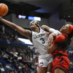 
              UConn's Aaliyah Edwards, left, fouls St. John's Jillian Archer as she reaches for a rebound in the second half of an NCAA college basketball game, Tuesday, Feb. 21, 2023, in Hartford, Conn. (AP Photo/Jessica Hill)
            