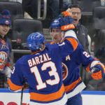 
              New York Islanders center Brock Nelson (29) celebrates after scoring against the Pittsburgh Penguins with center Mathew Barzal (13) during the second period of an NHL hockey game Friday, Feb. 17, 2023, in Elmont, N.Y. (AP Photo/Mary Altaffer)
            