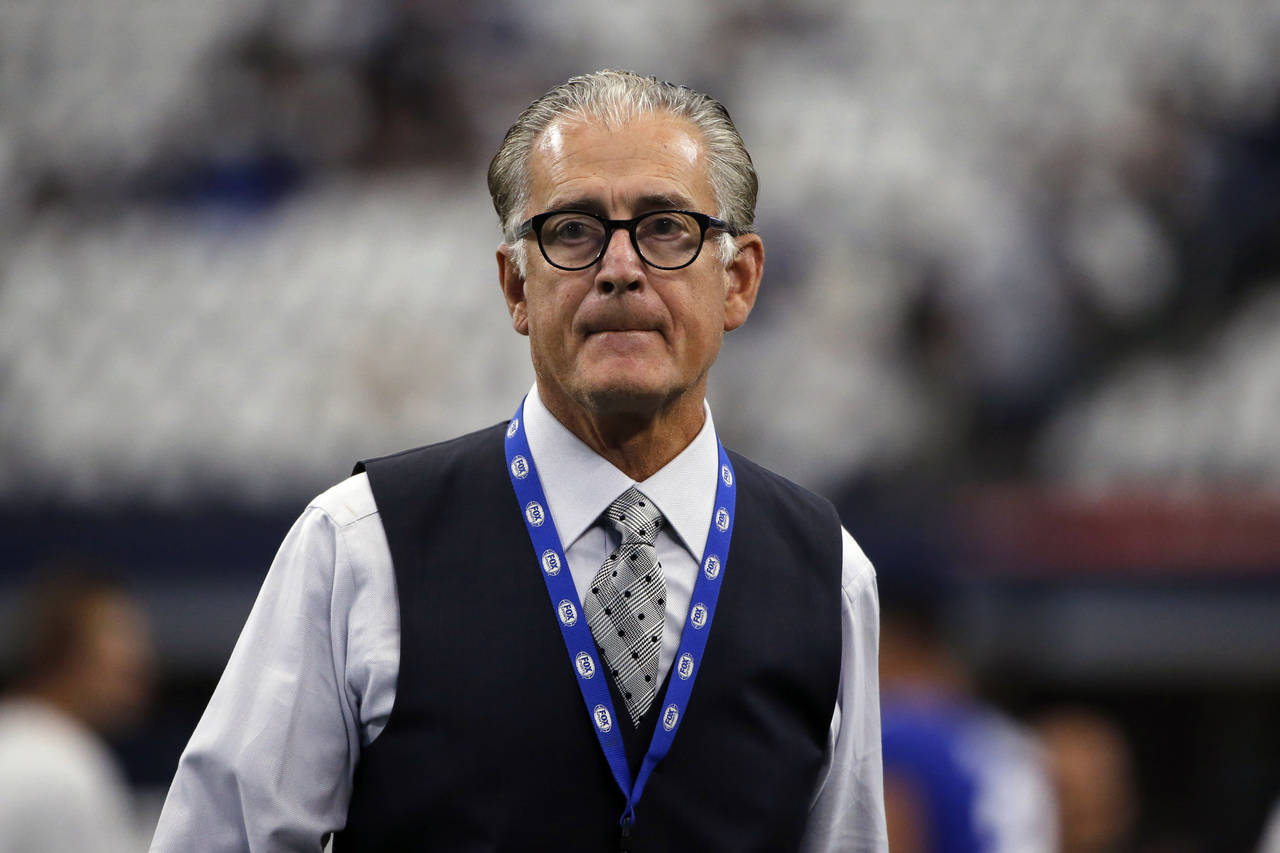 FILE - In this Sept. 8, 2019, file photo, former NFL official Mike Pereira walks across the field b...