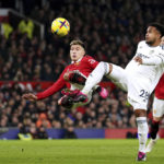 
              Leeds United's Weston McKennie, right, and Manchester United's Lisandro Martinez battle for the ball during an English Premier League soccer match at Old Trafford in Manchester, England, Wednesday, Feb. 8, 2023. (Martin Rickett/PA via AP)
            