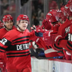 
              Detroit Red Wings right wing Jonatan Berggren (52) celebrates his gaol against the Vancouver Canucks in the first period of an NHL hockey game Saturday, Feb. 11, 2023, in Detroit. (AP Photo/Paul Sancya)
            