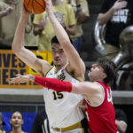 
              Ohio State forward Owen Spencer (44) defends Purdue center Zach Edey (15) in the first half of an NCAA college basketball game in West Lafayette, Ind., Sunday, Feb. 19, 2023. (AP Photo/Michael Conroy)
            