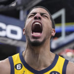 
              Indiana Pacers' Tyrese Haliburton reacts after a dunk during the second half of an NBA basketball game against the Sacramento Kings, Friday, Feb. 3, 2023, in Indianapolis. (AP Photo/Darron Cummings)
            