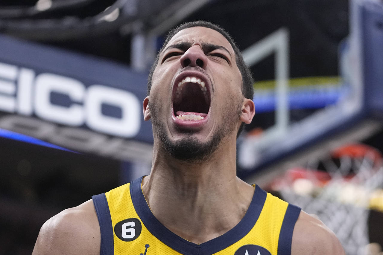 Indiana Pacers' Tyrese Haliburton reacts after a dunk during the second half of an NBA basketball g...