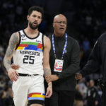 
              Minnesota Timberwolves guard Austin Rivers (25) exits the game after being ejected for participating in a scrum against the Orlando Magic during the second half of an NBA basketball game, Friday, Feb. 3, 2023, in Minneapolis. (AP Photo/Abbie Parr)
            