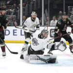 
              Los Angeles Kings goaltender Jonathan Quick, second from right, is scored on by Arizona Coyotes defenseman Josh Brown as left wing Nick Ritchie, left, right wing Christian Fischer, right, and defenseman Drew Doughty watch during the first period of an NHL hockey game Saturday, Feb. 18, 2023, in Los Angeles. (AP Photo/Mark J. Terrill)
            