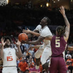 
              Florida State forward De'Ante Green (5) defends Miami guard Bensley Joseph (4) as he drives to the basket during the second half of an NCAA college basketball game, Saturday, Feb. 25, 2023, in Coral Gables, Fla. (AP Photo/Marta Lavandier)
            