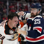 
              Washington Capitals defenseman Dylan McIlrath, right, swings at Anaheim Ducks center Sam Carrick during a fight in the second period of an NHL hockey game, Thursday, Feb. 23, 2023, in Washington. (AP Photo/Patrick Semansky)
            