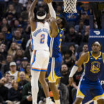 
              Oklahoma City Thunder guard Shai Gilgeous-Alexander (2) shoots over Golden State Warriors forward Andrew Wiggins, obscured, during the first half of an NBA basketball game in San Francisco, Monday, Feb. 6, 2023. (AP Photo/John Hefti)
            