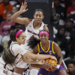 
              South Carolina guard Brea Beal, left, tries to strip the ball from LSU guard Flau'jae Johnson as South Carolina forward Aliyah Boston, top, looks on during the first half of an NCAA college basketball game in Columbia, S.C., Sunday, Feb. 12, 2023. (AP Photo/Nell Redmond)
            