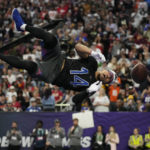 
              NFC wide receiver Amon-Ra St. Brown (14) of the Detroit Lions makes a catch during the best catch event at the NFL Pro Bowl, Sunday, Feb. 5, 2023, in Las Vegas. (AP Photo/John Locher)
            