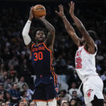 
              New York Knicks' Julius Randle, left, shoots over Miami Heat's Jimmy Butler during the second half of an NBA basketball game Thursday, Feb. 2, 2023, in New York. (AP Photo/Frank Franklin II)
            