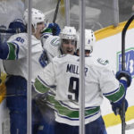 
              Vancouver Canucks' Andrei Kuzmenko, left, celebrates with Conor Garland (8) and J.T. Miller (9) after Kuzmenko scored the tying goal against the Nashville Predators during the third period of an NHL hockey game Tuesday, Feb. 21, 2023, in Nashville, Tenn. The Predators won 5-4 in a shootout. (AP Photo/Mark Zaleski)
            