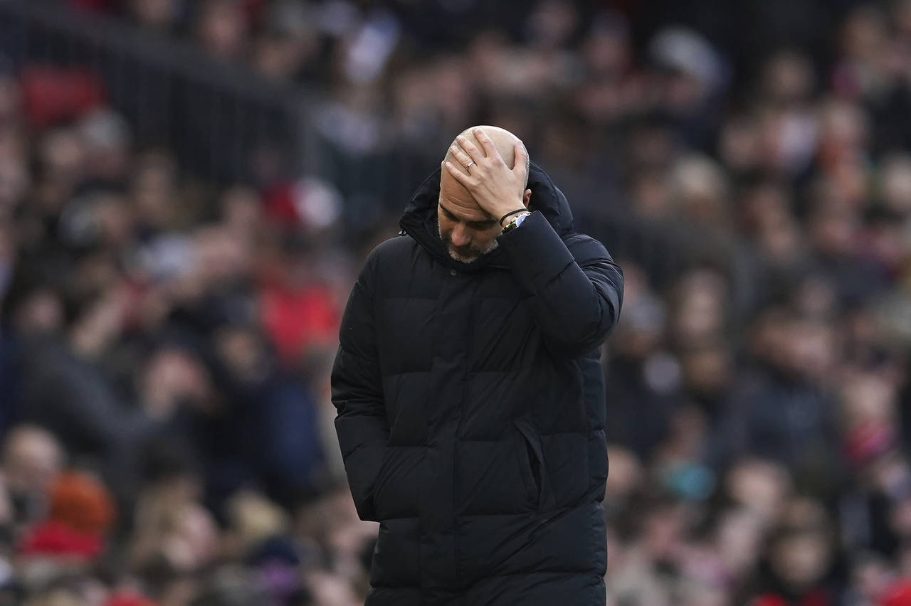 Manchester City's head coach Pep Guardiola reacts during the English Premier League soccer match be...