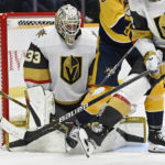 
              Vegas Golden Knights goaltender Adin Hill (33) deflects a Nashville Predators shot during the second period of an NHL hockey game Tuesday, Feb. 7, 2023, in Nashville, Tenn. (AP Photo/Mark Zaleski)
            