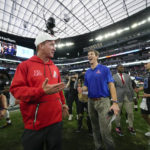 
              AFC coach Peyton Manning, left, jokes with NFC coach Eli Manning after the flag football event at the NFL Pro Bowl, Sunday, Feb. 5, 2023, in Las Vegas. (AP Photo/John Locher)
            