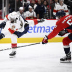 
              Florida Panthers right wing Givani Smith (54) shoots the puck and breaks the stick of Washington Capitals defenseman Trevor van Riemsdyk (57) during the second period of an NHL hockey game Thursday, Feb. 16, 2023, in Washington. (AP Photo/Nick Wass)
            