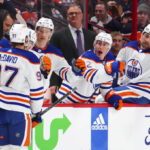 
              Edmonton Oilers center Connor McDavid (97) celebrates a goal with teammates while taking on the Ottawa Senators during the first period of an NHL hockey game in Ottawa on Saturday, Feb. 11, 2023. (Sean Kilpatrick/The Canadian Press via AP)
            