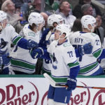 
              Vancouver Canucks left wing Anthony Beauvillier (72) celebrates with the bench after scoring in the first period of an NHL hockey game against the Dallas Stars, Monday, Feb. 27, 2023, in Dallas. (AP Photo/Tony Gutierrez)
            