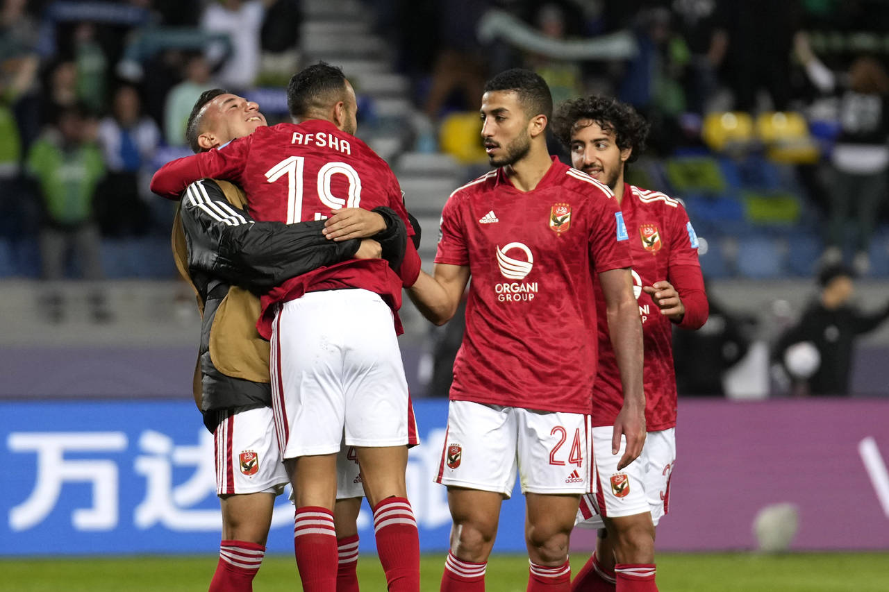 Al Ahly players celebrate after Al Ahly's Mohamed Afsha scored his side's opening goal during the F...