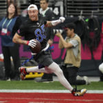 
              NFC tight end George Kittle (85) of the San Francisco 49ers scores a touchdown during the flag football event at the NFL Pro Bowl against the AFC, Sunday, Feb. 5, 2023, in Las Vegas. (AP Photo/John Locher)
            