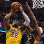 
              Indiana Pacers center Myles Turner (33) blocks the shot of Los Angeles Lakers forward Rui Hachimura (28) during the first half of an NBA basketball game in Indianapolis, Thursday, Feb. 2, 2023. (AP Photo/Michael Conroy)
            