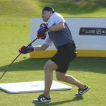 
              Nick Suzuki of the Montreal Canadiens, hits his first shot with a hockey stick during a golf skills competition, Wednesday, Feb. 1, 2023, in Plantation, Fla. The event was part of the NHL All Star weekend. (AP Photo/Marta Lavandier)
            