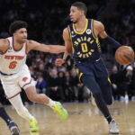 
              Indiana Pacers guard Tyrese Haliburton (0) drives against New York Knicks guard Quentin Grimes (6) in the first half of an NBA basketball game, Wednesday, Jan. 11, 2023, at Madison Square Garden in New York. (AP Photo/Mary Altaffer)
            