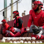 
              Cincinnati Reds catchers run drills during an MLB spring training baseball practice, Friday, Feb. 17, 2023, in Goodyear, Ariz. (AP Photo/Matt York)
            