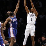 
              Brooklyn Nets' Mikal Bridges, right, shoots against Philadelphia 76ers' James Harden, left, during the second quarter of an NBA basketball game Saturday, Feb. 11, 2023, in New York. (AP Photo/Jason DeCrow)
            
