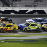 
              Joey Logano (22) crosses the finish line ahead of Christopher Bell (20), Ryan Blaney (12), Chris Buescher (17) and Michael McDowell (34) to win the first of two qualifying auto races for the NASCAR Daytona 500 at Daytona International Speedway, Thursday, Feb. 16, 2023, in Daytona Beach, Fla.(AP Photo/Terry Renna)
            
