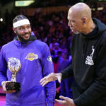 
              FILE -Former Los Angeles Lakers center Kareem Abdul-Jabbar, right, hands Los Angeles Lakers' Carmelo Anthony the Kareem Abdul-Jabbar Trophy for the league's annual Social Justice Champion prior to an NBA basketball game against the Denver Nuggets Sunday, April 3, 2022, in Los Angeles. Kareem Abdul-Jabbar's reign atop the NBA career scoring list is about to end after nearly four decades. LeBron James is on the verge of passing Abdul-Jabbar for the record that he's held since 1984.(AP Photo/Mark J. Terrill, File)
            