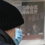 
              A man looks at a kiosk displaying a newspaper with a photo of Chen Xuyuan, head of the Chinese Football Association, in Beijing, Wednesday, Feb. 15, 2023. The head of China's national soccer federation has been arrested on corruption charges in the latest blow to the country's effort to grow its standing at home and internationally. (AP Photo/Andy Wong)
            