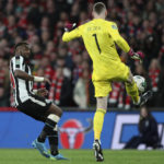 
              Manchester United's goalkeeper David de Gea, right, clears the ball in front Newcastle's Allan Saint-Maximin during the English League Cup final soccer match between Manchester United and Newcastle United at Wembley Stadium in London, Sunday, Feb. 26, 2023. (AP Photo/Scott Heppell)
            