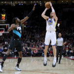 
              Golden State Warriors guard Klay Thompson, right, shoots a 3-pointer over Portland Trail Blazers forward Jerami Grant during the first half of an NBA basketball game in Portland, Ore., Wednesday, Feb. 8, 2023. (AP Photo/Craig Mitchelldyer)
            