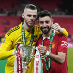 
              Manchester United's Bruno Fernandes, right, and goalkeeper David de Gea pose with the trophy after the English League Cup final soccer match between Manchester United and Newcastle United at Wembley Stadium in London, Sunday, Feb. 26, 2023. (AP Photo/Alastair Grant)
            
