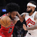 
              Chicago Bulls guard Coby White (0) tries to get past Toronto Raptors guard Gary Trent Jr. (33) during the first half of an NBA basketball game Tuesday, Feb. 28, 2023, in Toronto. (Frank Gunn/The Canadian Press via AP)
            