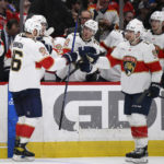 
              Florida Panthers center Aleksander Barkov (16) celebrates his goal against the Washington Capitals with center Sam Reinhart (13) and others during the second period of an NHL hockey game Thursday, Feb. 16, 2023, in Washington. (AP Photo/Nick Wass)
            