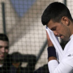 
              Serbian tennis player Novak Djokovic wipes his face during his open practise session in Belgrade, Serbia, Wednesday, Feb. 22, 2023. Djokovic said Wednesday he still hopes US border authorities would allow him entry to take part in two ATP Masters tennis tournaments despite being unvaccinated against the coronavirus. (AP Photo/Darko Vojinovic)
            