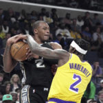 
              Memphis Grizzlies Xavier Tillman Sr. (2) battles for the ball against LosAngeles Lakers Jarred Vanderbilt (2) in the first half of an NBA basketball game, Tuesday, Feb. 28, 2023, in Memphis, Tenn. (AP Photo/Karen Pulfer Focht)
            