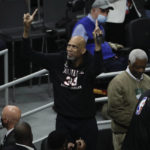 
              FILE -Kareem Abdul-Jabbar reacts during the first half of Game 4 of basketball's NBA Finals between the Milwaukee Bucks and the Phoenix Suns, Wednesday, July 14, 2021, in Milwaukee. Kareem Abdul-Jabbar's reign atop the NBA career scoring list is about to end after nearly four decades. LeBron James is on the verge of passing Abdul-Jabbar for the record that he's held since 1984.(AP Photo/Aaron Gash, File)
            
