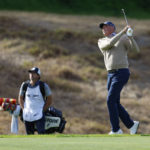
              Matt Kuchar hits his approach shot to the seventh hole during the first round of the Genesis Invitational golf tournament at Riviera Country Club, Thursday, Feb. 16, 2023, in the Pacific Palisades area of Los Angeles. (AP Photo/Ryan Kang)
            