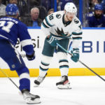 
              San Jose Sharks left wing Evgeny Svechnikov (10) tries to work around Tampa Bay Lightning center Steven Stamkos (91) during the first period of an NHL hockey game Tuesday, Feb. 7, 2023, in Tampa, Fla. (AP Photo/Chris O'Meara)
            