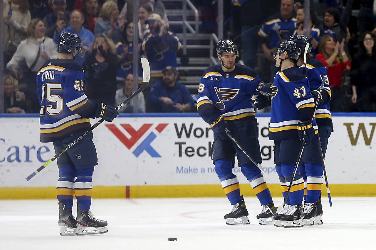 St. Louis Blues' Torey Krug (47) is congratulated by teammates after scoring a goal against the Flo...