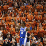 
              The Virginia crowd cheers after a foul call against Duke during overtime of an NCAA college basketball game in Charlottesville, Va., Saturday, Feb. 11, 2023. (AP Photo/Mike Kropf)
            