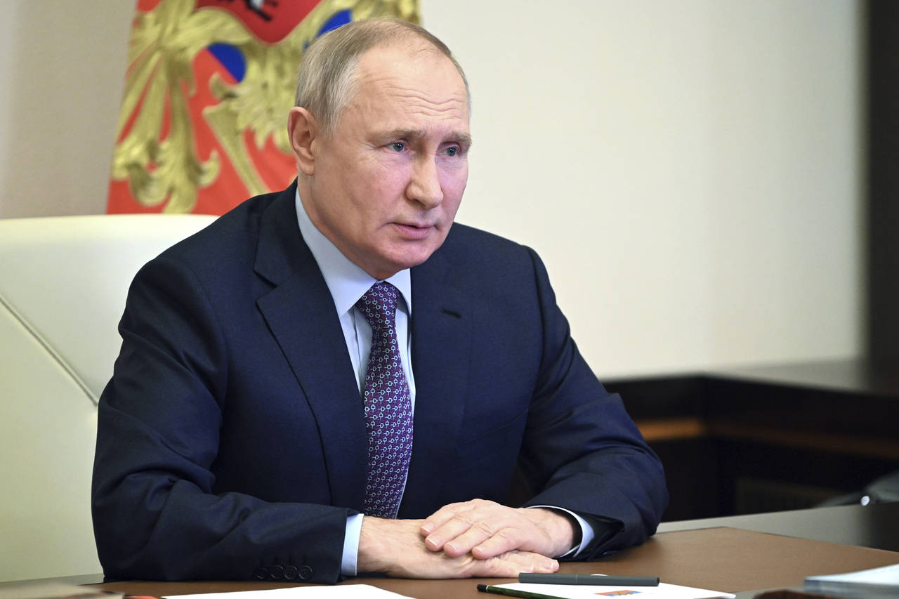 Russian President Vladimir Putin chairs a meeting with members of the Security Council via a video ...