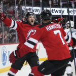 
              New Jersey Devils' Dawson Mercer (91) celebrates with teammate Dougie Hamilton (7) after scoring the game winning goal during the overtime period of an NHL hockey game against the Los Angeles Kings Thursday, Feb. 23, 2023, in Newark, N.J. The Devils won 4-3.(AP Photo/Frank Franklin II)
            