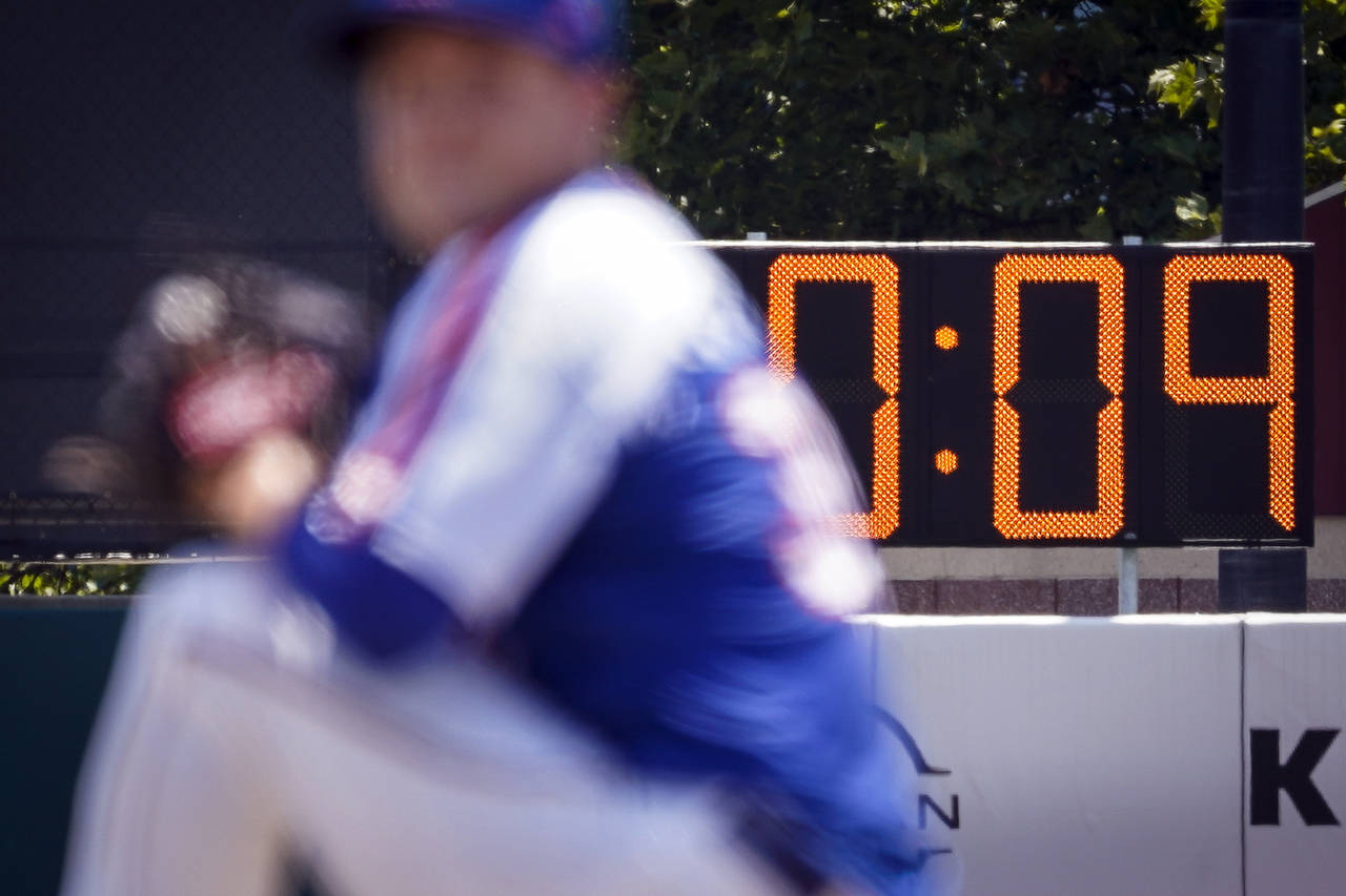 FILE -  A pitch clock is deployed to restrict pitcher preparation times during a minor league baseb...
